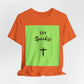 God Speakss Unisex Jersey in orange with green graphic featuring 'God Speakss' and a cross design.